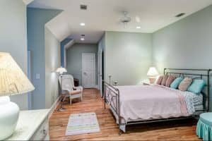 Tasteful loft bedroom with hard wood floors in Woodville