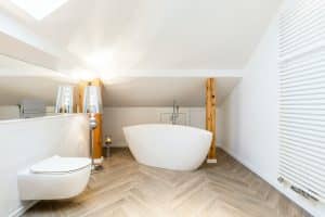 White loft bathroom with bathtub