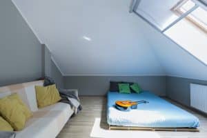 Attic minimalist bedroom with mattress in Dale Abbey